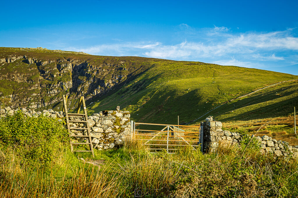Lush Green Mountains Of Wales With Stye and Gate