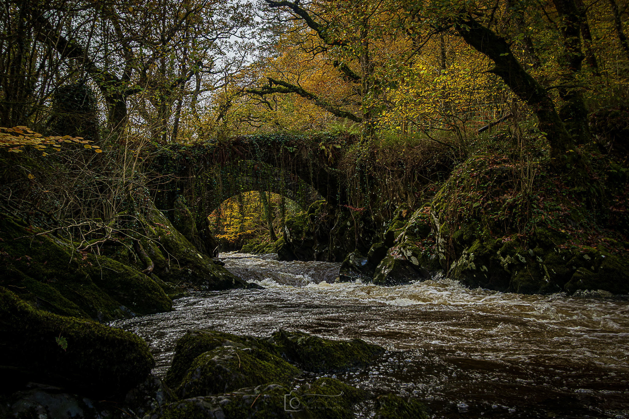 Foreboding Autumnal Roman Packhorse Bridge Rapids